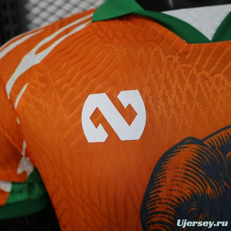 Player Version 2025 Ivory Coast Orange with Elephant Graphic and Green Accents Jersey