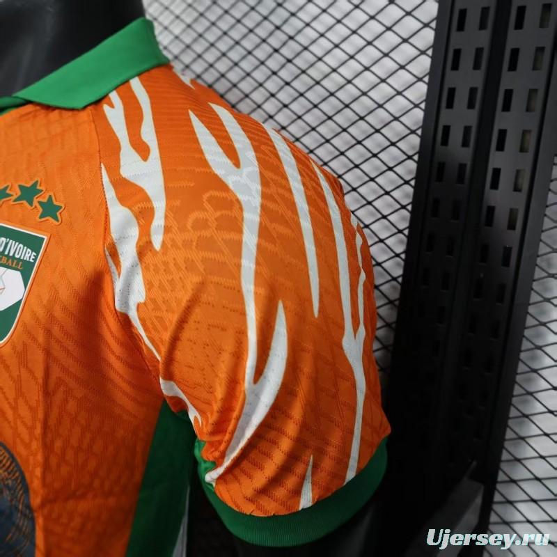 Player Version 2025 Ivory Coast Orange with Elephant Graphic and Green Accents Jersey